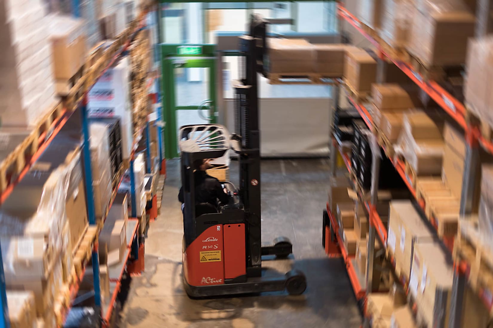 Forklift moving boxes